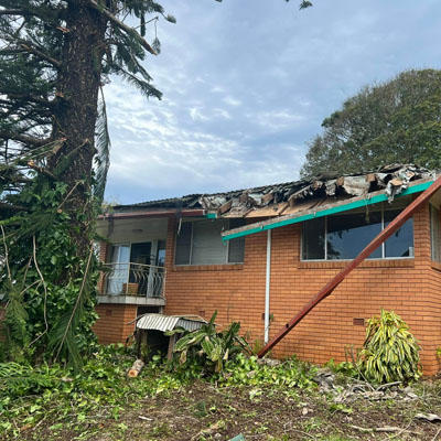 Damage to roof caused by overhanging tree branches